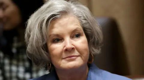 Susie Wiles, wearing a blue blazer, at the White House in March 2025